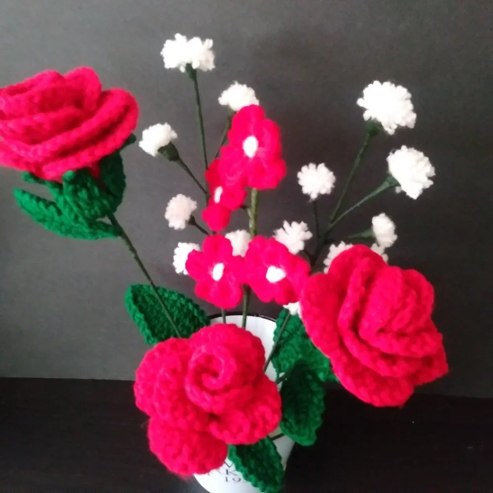 Handmade crochet bouquet of red roses,